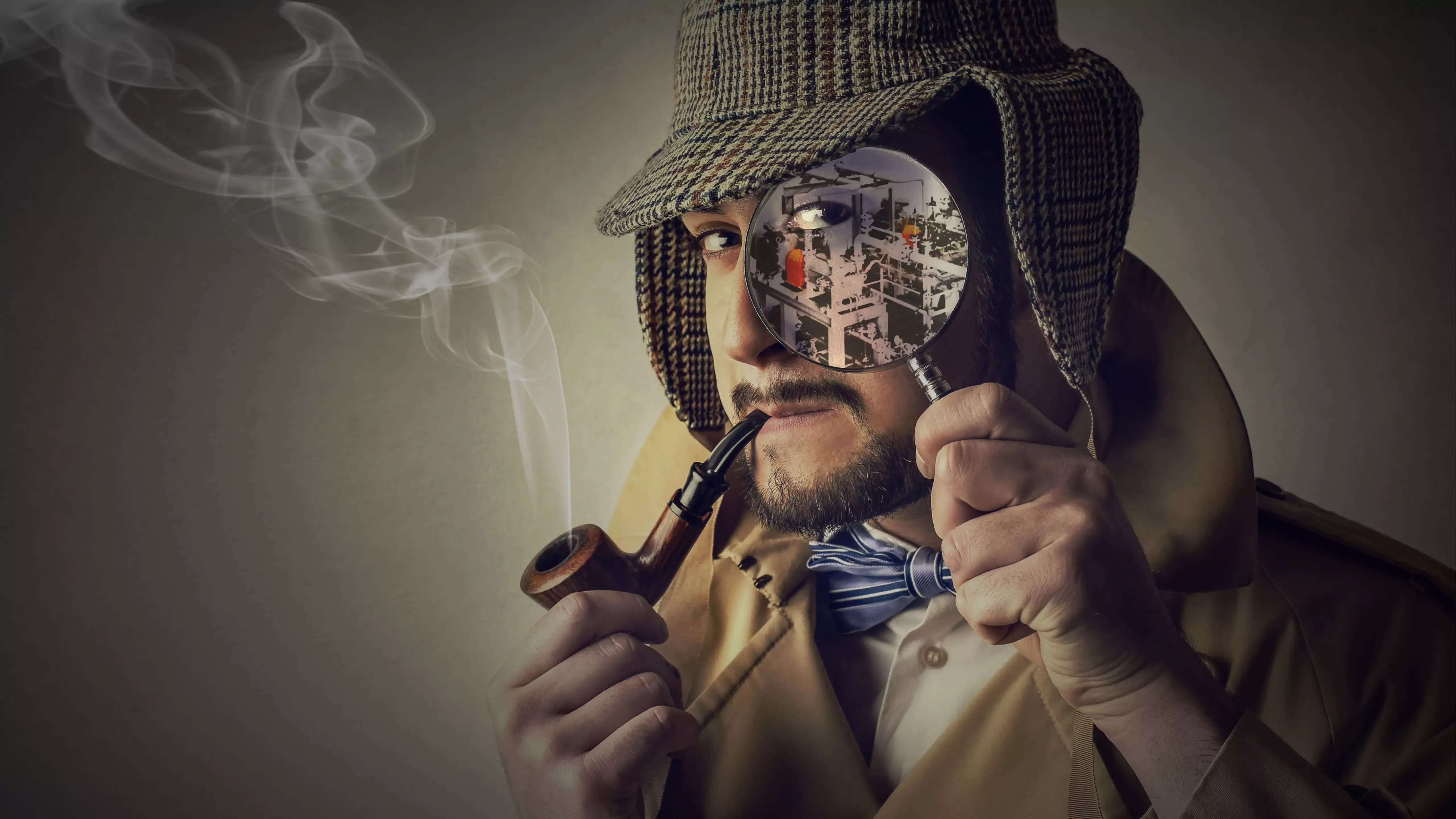 A man wearing a hat and coat holds a whistle and looks through a magnifying glass.